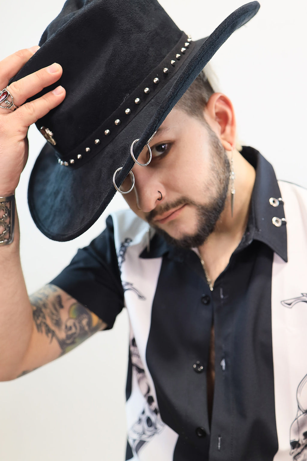 Man wearing the skullcap cowboy hat.