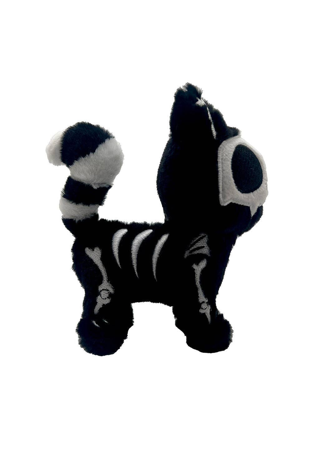 Black and white plush toy on a white background