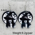A pair of silver-tone stud earrings with black and white circular designs featuring a stylized face and crescent moon, shown on a white background with text indicating 6.4cm size and 6.