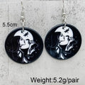 A pair of black round drop earrings with white printed portraits of a woman, shown on a white background with text indicating 5.5cm size and 5.