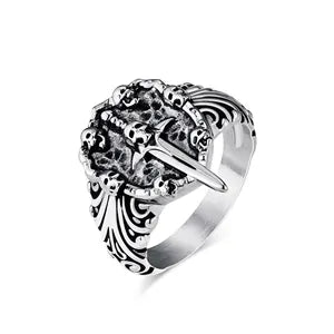 Silver ring with intricate design on a white background