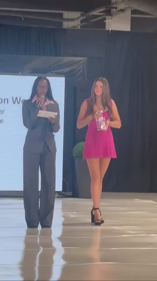 Load video: Angel is recognized as &quot;Designer of the Year&quot; by Atlantic City Fashion Week. She is so excited and humbled to accept this prestigious award and title.